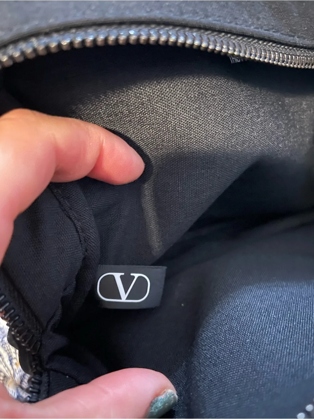 Valentino Black Travel Cosmetic Pouch with Wrist Strap with perfumed lotion